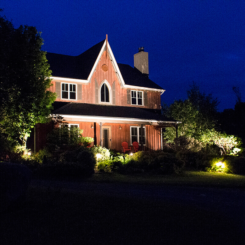 Cottage front illuminated at night